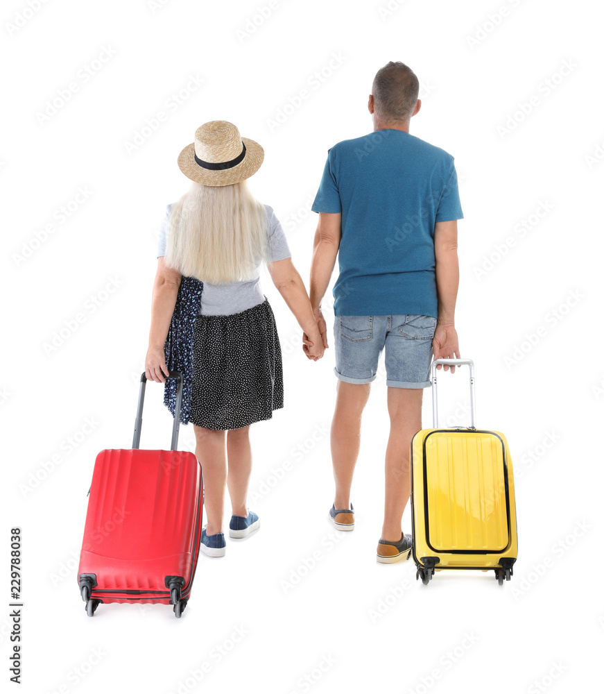 Senior couple with suitcases on white background. Vacation travel Senior couple with suitcases on white background. Vacation travel