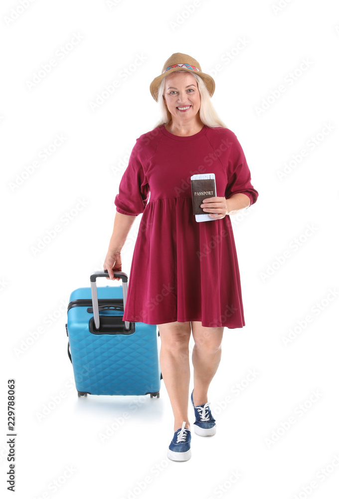 Senior woman with suitcase and passport on white background. Vacation travel Senior woman with suitcase and passport on white background. Vacation travel