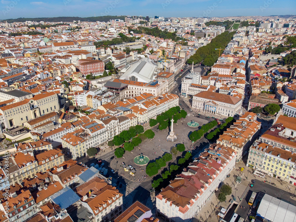 The aerial view on Pedro IV Square with the same named Column and The National Theatre of Lisbon, Portugal.
