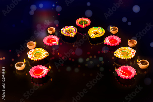 Happy Diwali Diya lamps lit during diwali celebration