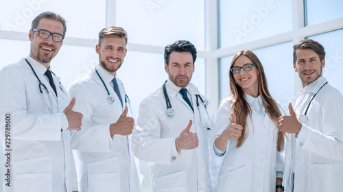 group of doctors showing thumbs up