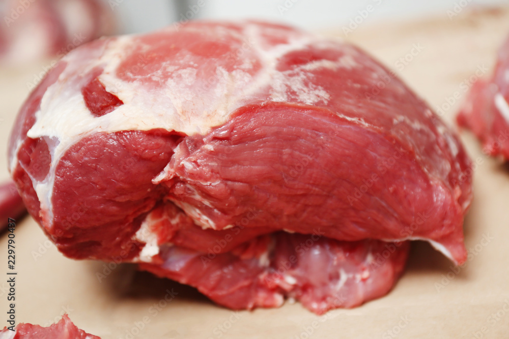 Pieces of fresh raw meat on counter in butcher shop Pieces of fresh raw meat on counter in butcher shop