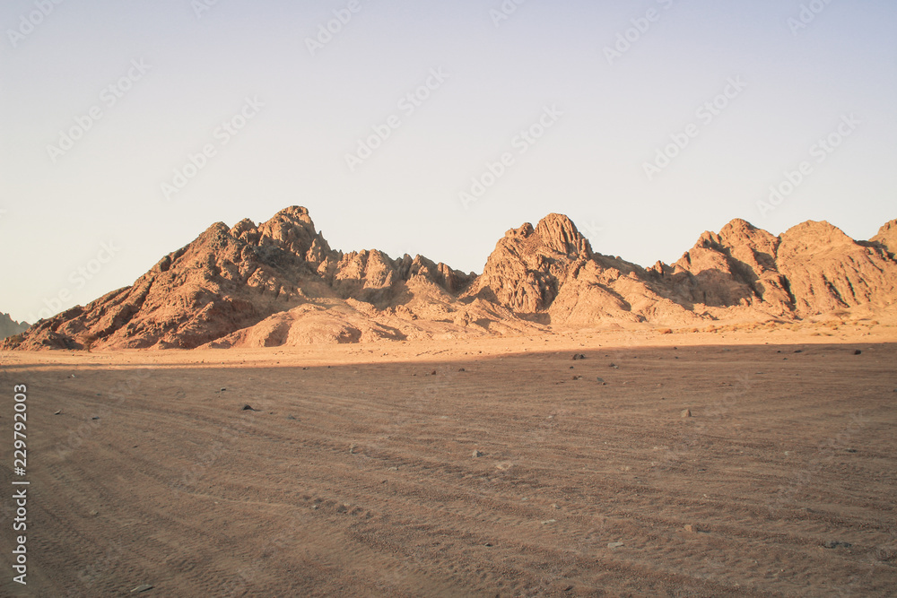 Desert in Egypt. Sharm el Sheikh. Sand and Sand Borkhan. Rock and sunset.