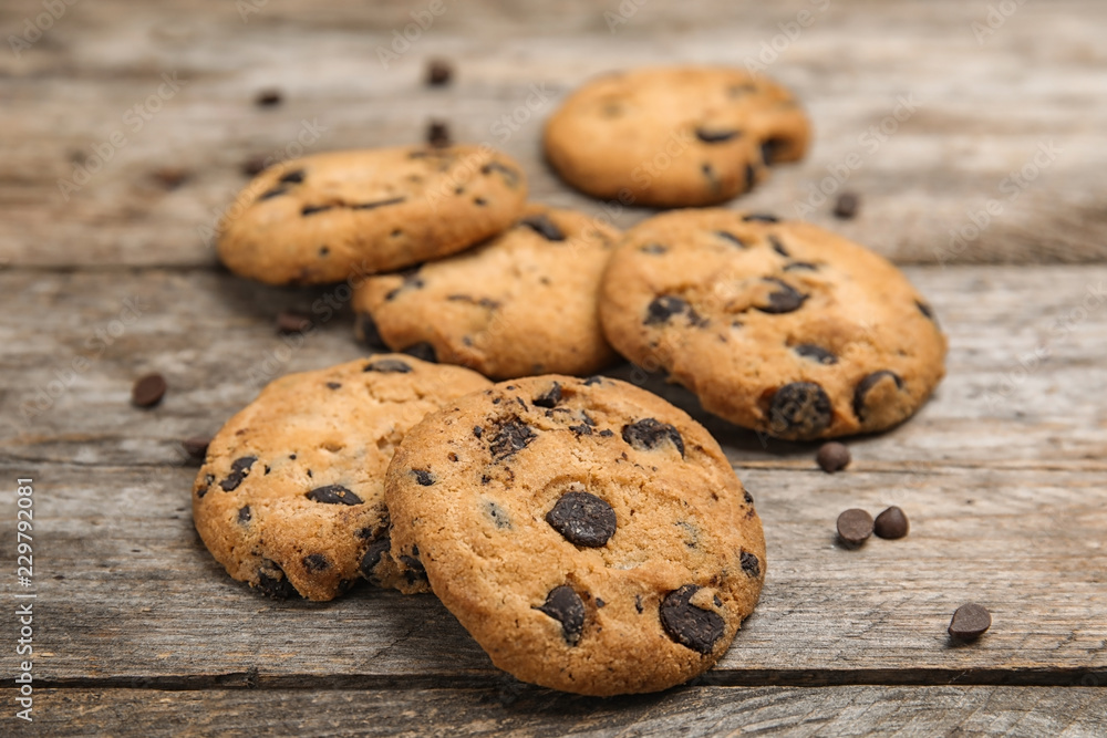 Delicious chocolate chip cookies on wooden table Delicious chocolate chip cookies on wooden table