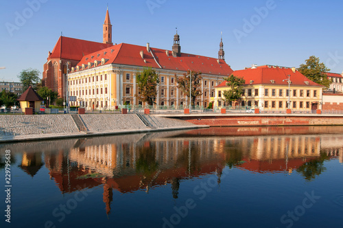 Wroclaw, Poland August 2018.University of Wroclaw, Institute of Polish Studies. With reflection in Odra River in the morning sun.