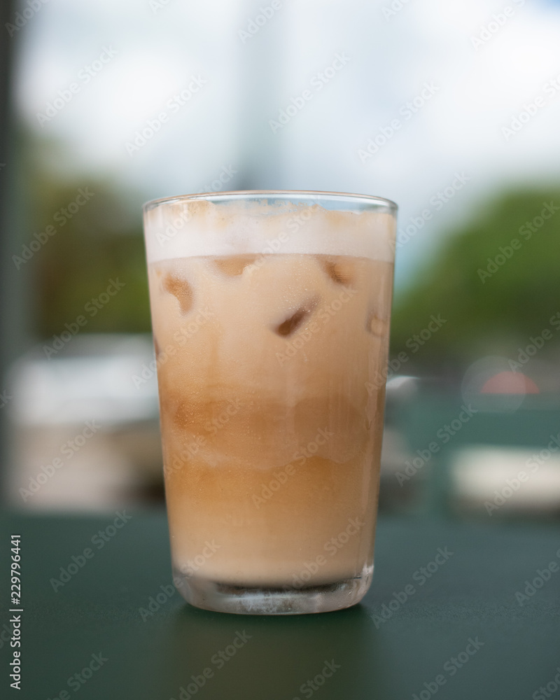 An iced latte in a glass An iced latte in a glass