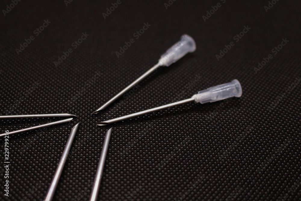 Cannula iIsolated on black background. Medical needle. Macro shot Cannula iIsolated on black background. Medical needle. Macro shot