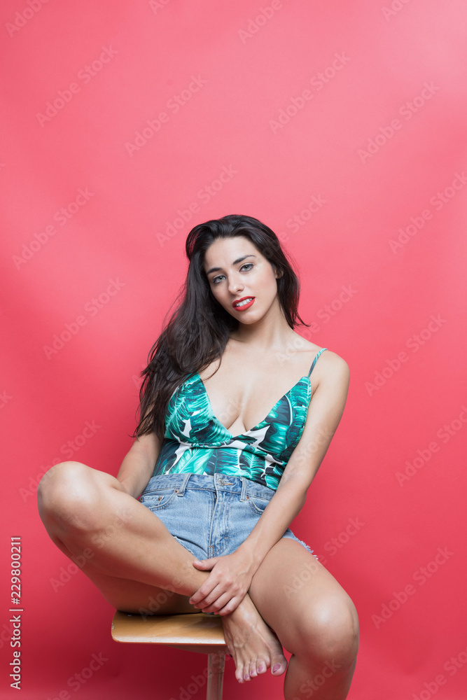 Young woman sitting on chair Young woman sitting on chair