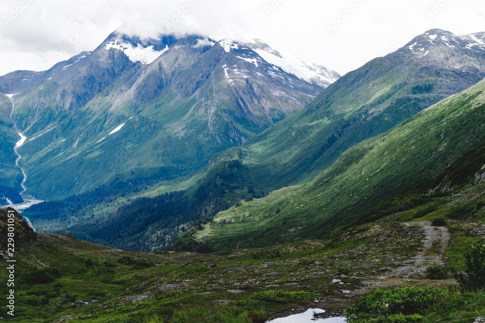 Fototapeta premium Lovely view of mountains and rolling hills, and glaciers along the Trail of '98 in Valdez Alaska along the Richardson Highway