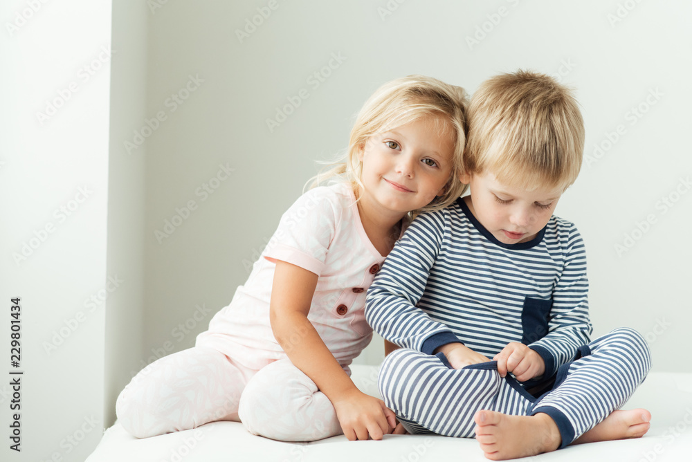 Smiling girl leaning on brother Smiling girl leaning on brother