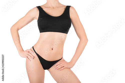 Female cropped fit body in black base top and panties, isolated on white.