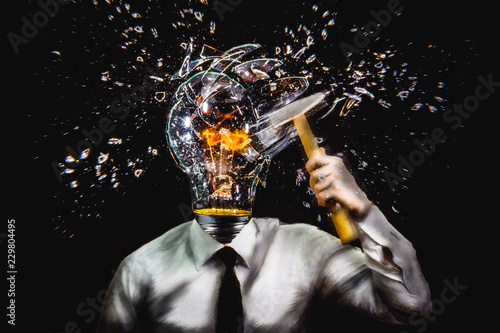 Surreal illustration. Man with lamp head shattering his own lamp, concept of self sabotage. photo