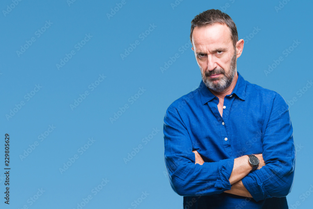 Middle age hoary senior man over isolated background skeptic and nervous, disapproving expression on face with crossed arms. Negative person. Middle age hoary senior man over isolated background skeptic and nervous, disapproving expression on face with crossed arms. Negative person.