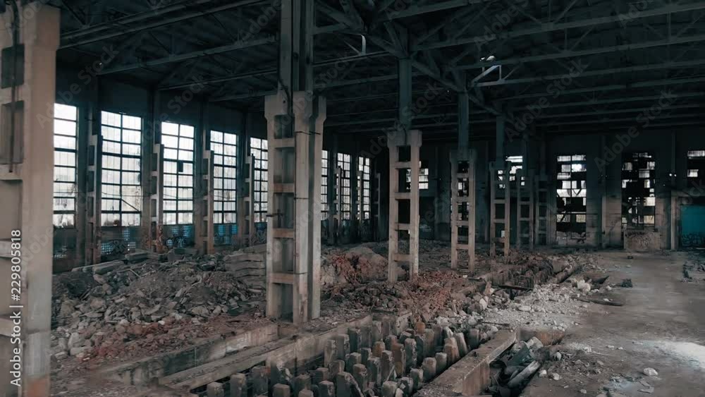 4k aerial view. Destroyed abandoned factory after the war, broken glass, destruction, frightening industrial composition 4k aerial view. Destroyed abandoned factory after the war, broken glass, destruction, frightening industrial composition