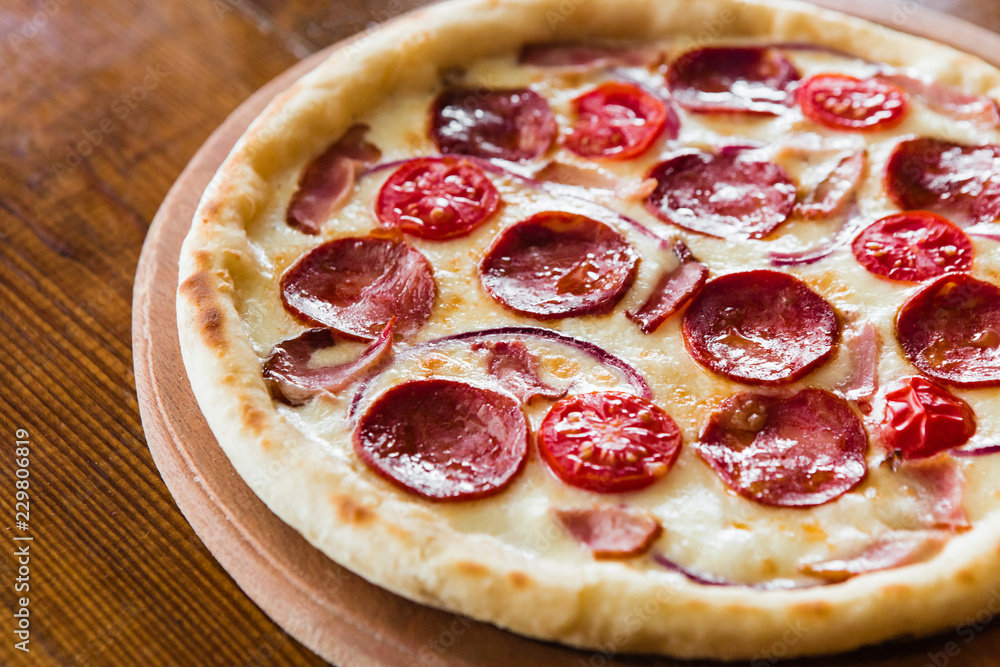delicious pizza with meat, cheese and mushrooms delicious pizza with meat, cheese and mushrooms