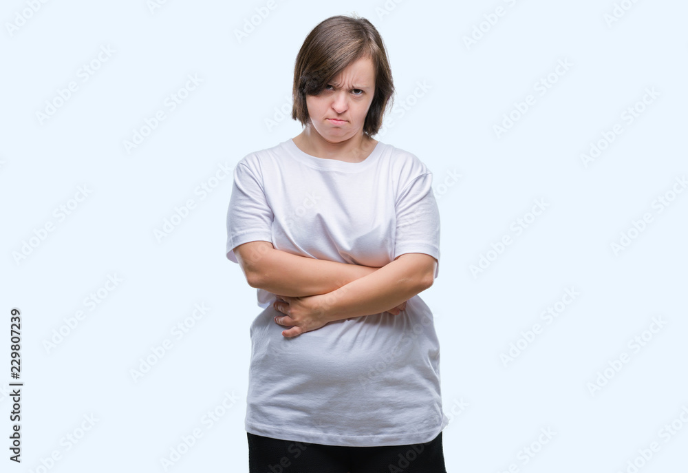 Young adult woman with down syndrome over isolated background skeptic and nervous, disapproving expression on face with crossed arms. Negative person. Young adult woman with down syndrome over isolated background skeptic and nervous, disapproving expression on face with crossed arms. Negative person.