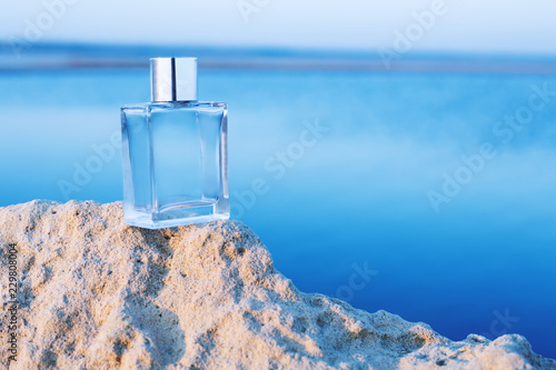 ..Perfume bottle on blue background