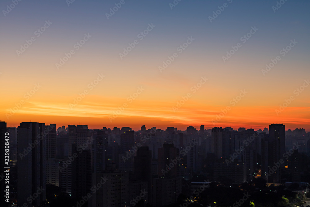 Big black city silhouette and sunset. Silhouette of the city of Sao Paulo, Brazil South America. 