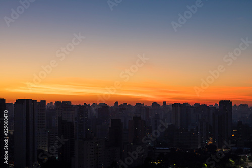 Big black city silhouette and sunset. Silhouette of the city of Sao Paulo  Brazil South America. 