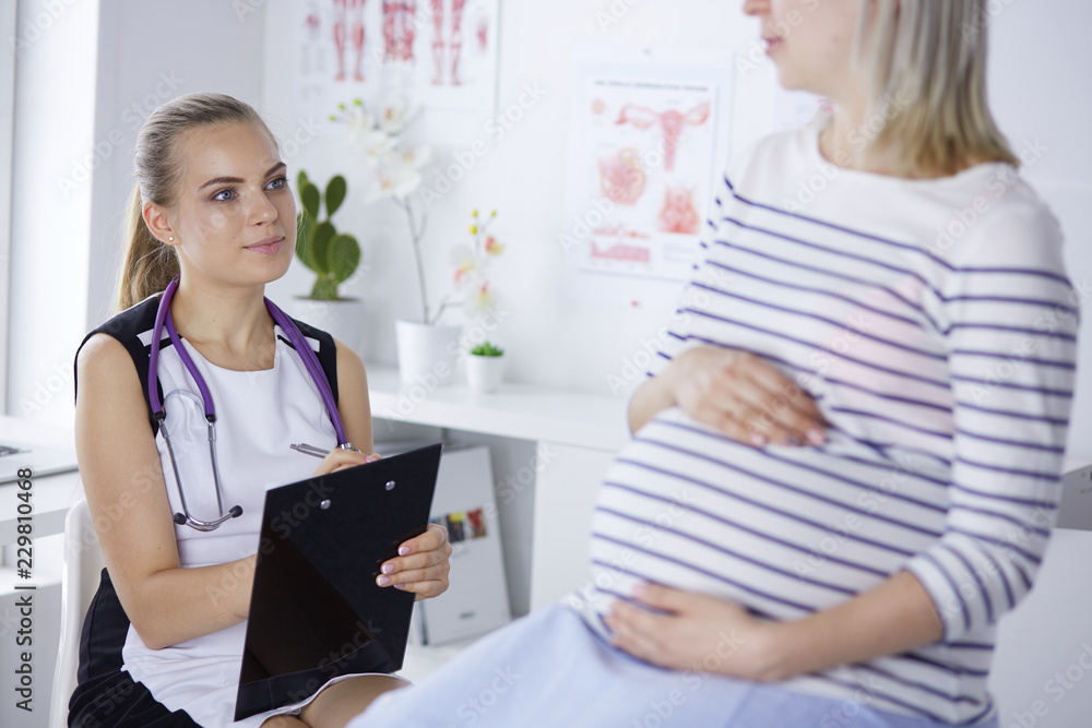 Gynecology consultation. Pregnant woman with her doctor in clinic Gynecology consultation. Pregnant woman with her doctor in clinic