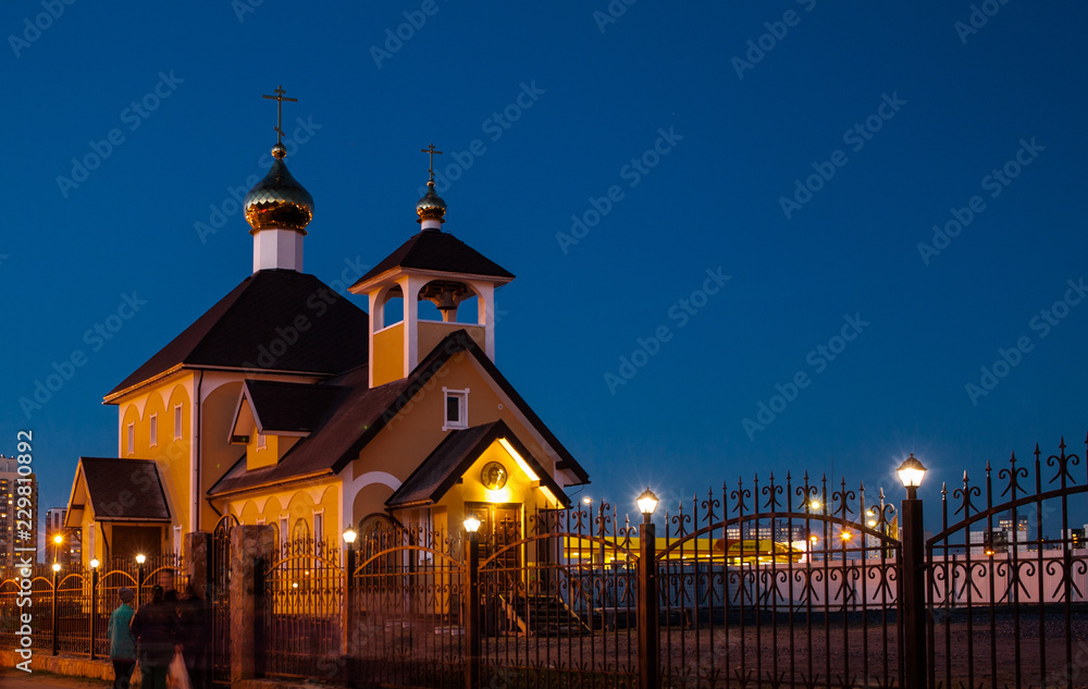 Fototapeta premium Church at evening in blue sky