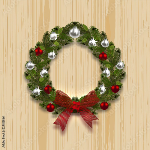 A green branch ate in the shape of a Christmas wreath with a shadow. Silver and red balls, red bow on the background of natural wood. illustration