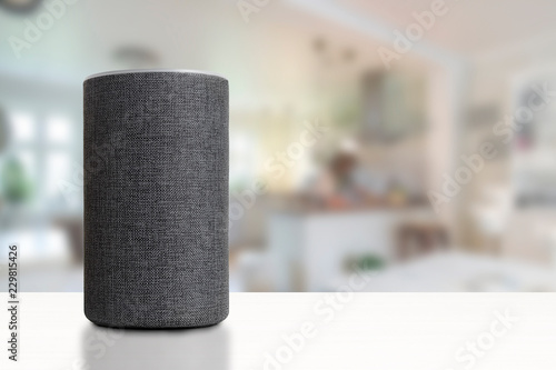 Personal assistant loudspeaker on a white wooden shelf of a smart home kitchen. Empty copy space for Editor's text. photo