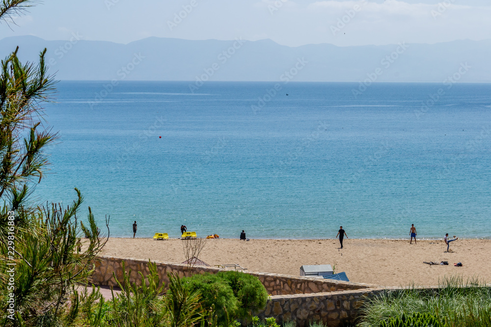 A wonderful view of Hoceima beach and waves and rocks in a sunny day A wonderful view of Hoceima beach and waves and rocks in a sunny day