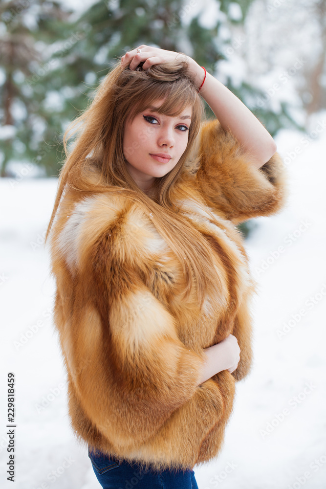 Beautiful elegant brunette woman wearing fur coat Beautiful elegant brunette woman wearing fur coat