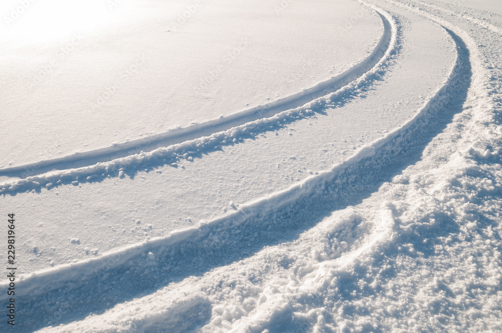 Car tire tracks in fresh snow Car tire tracks in fresh snow
