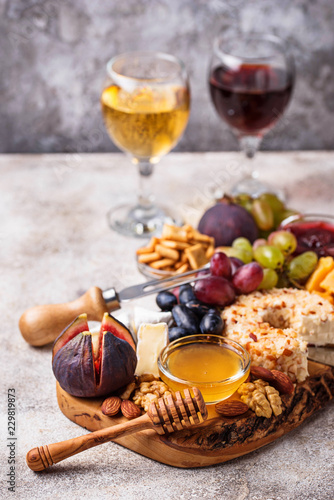 Cheese plate with grapes and wine