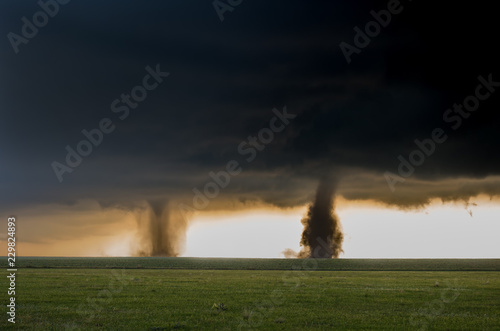 Two tornadoes touch down simultaneously in the plains of eastern Colorado, a rare and spectacular weather event.