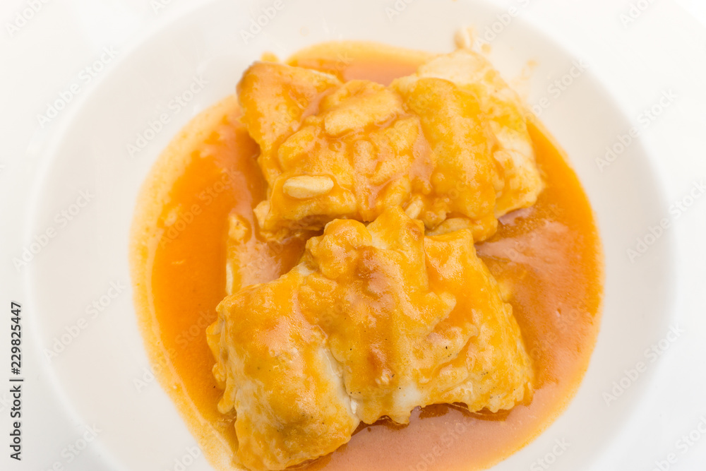 Merluza a la sidra, hake in cider sauce, spanish typical food Merluza a la sidra, hake in cider sauce, spanish typical food