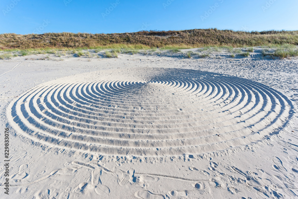 huge mysterious abstract circles on the sand of a beach huge mysterious abstract circles on the sand of a beach