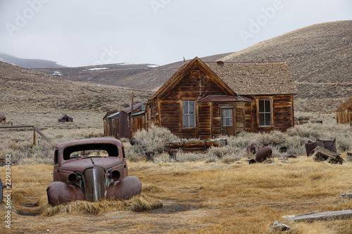 Rusty car slowly decaying in the rugged wilderness in the heart of California.