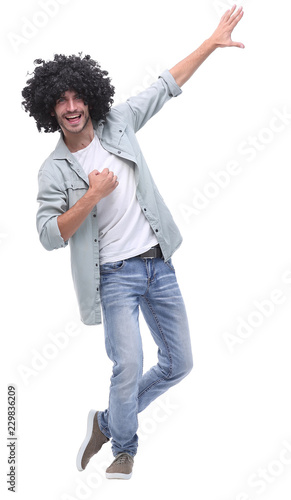 in full growth. stylish young man pointing to copy space