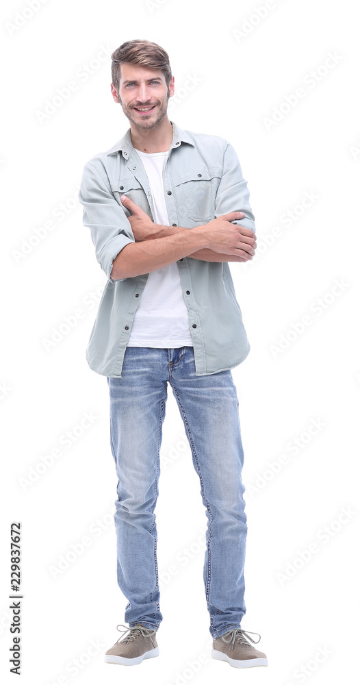 Fototapeta premium in full growth. smiling young man in jeans