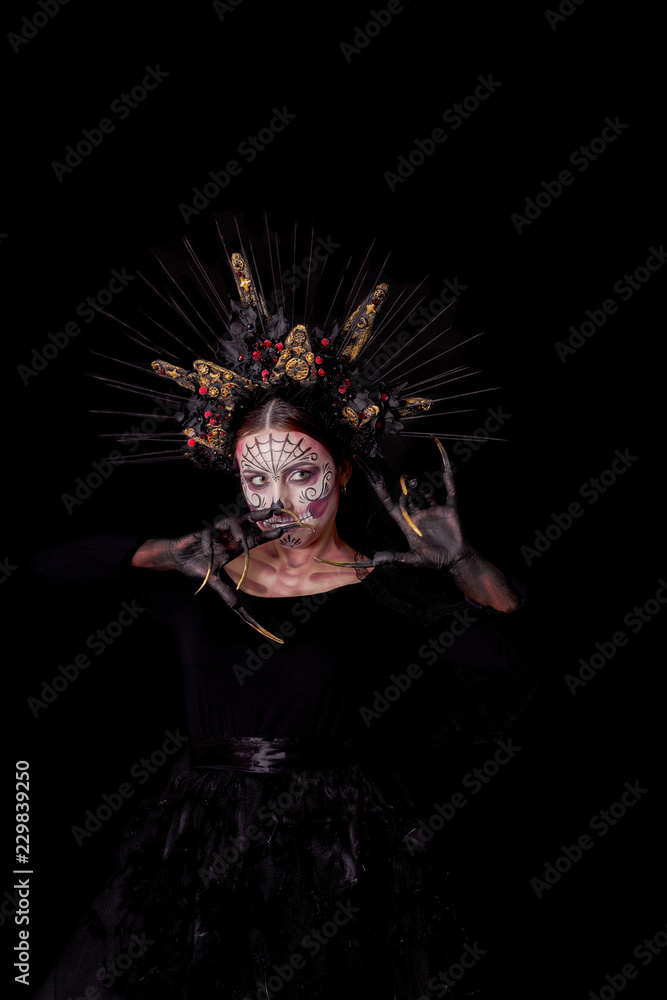 Closeup portrait of Calavera Catrina. Young woman with sugar skull makeup. Dia de los muertos. Day of The Dead. Halloween.