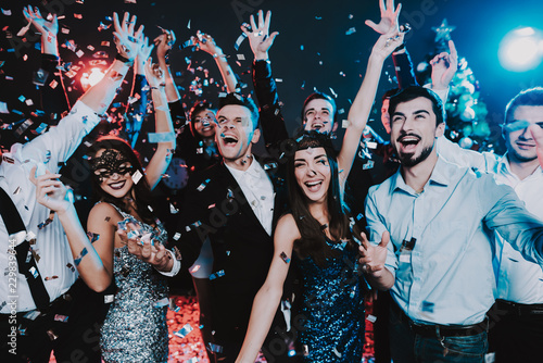 Smiling People Celebrating New Year on Party. photo