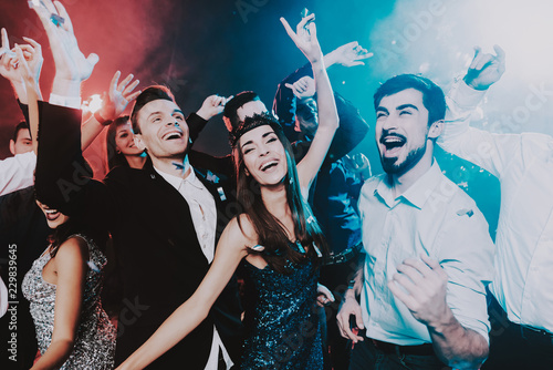 Smiling People Celebrating New Year on Party.