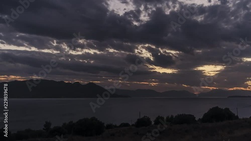 Time lapse of day to night at Aigina island, close to Athens,Greece. photo