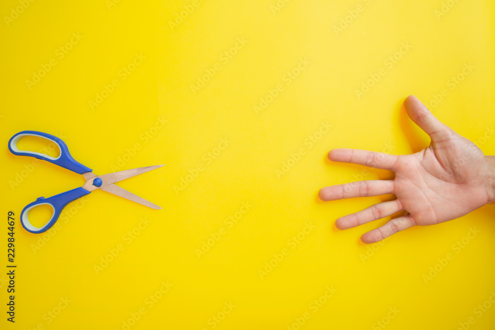Rock Paper Scissors on yellow background, Top View, Copy-space. Rock Paper Scissors on yellow background, Top View, Copy-space.