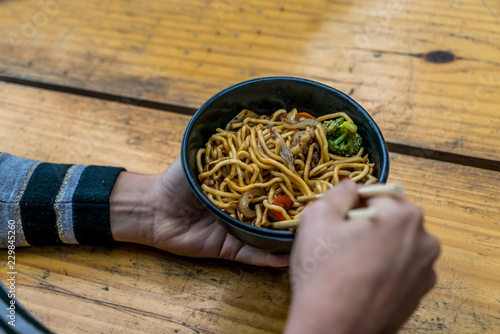 Traditional chinese food noodle served in a bowl photo