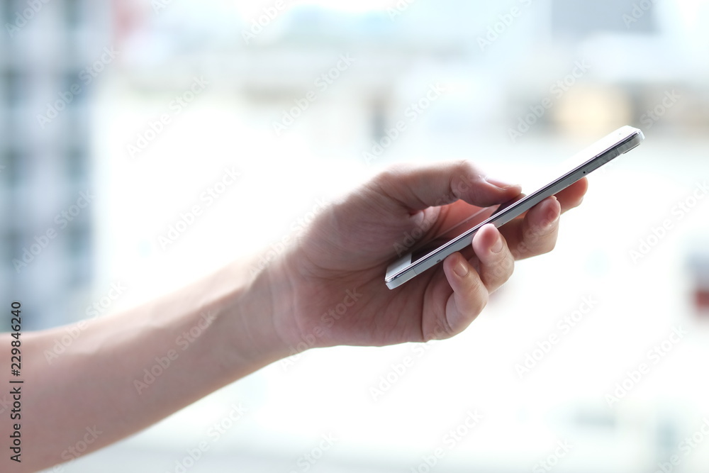 Close up of a man using mobile Smartphone. Social network, Social media and digital online, Internet searching, Connection, Communication and wireless technology concept. Close up of a man using mobile Smartphone. Social network, Social media and digital online, Internet searching, Connection, Communication and wireless technology concept.
