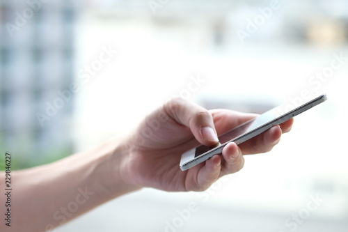 Close up of a man using mobile smart phone. Social network, Social media and digital online, Internet searching, Connection, Communication and wireless technology concept.