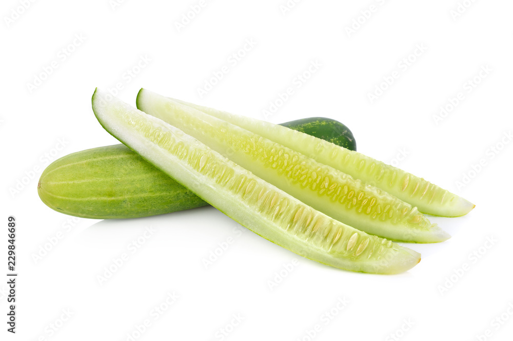 whole and cut fresh cucumbers on white background whole and cut fresh cucumbers on white background
