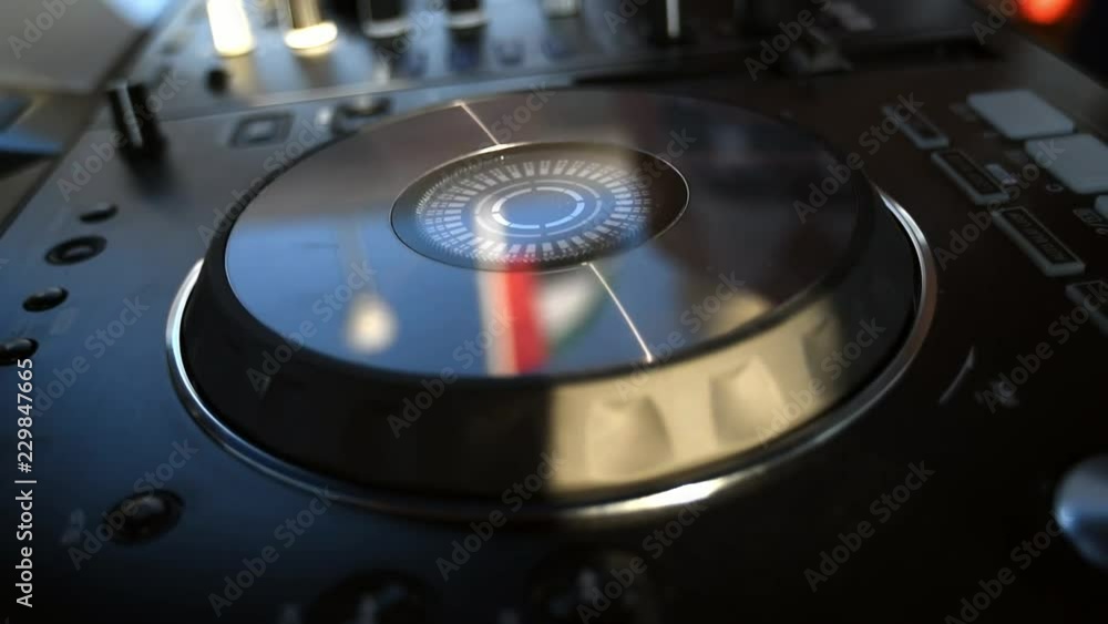 UAE flag reflects from dj turntable when dj plays music on yacht party UAE flag reflects from dj turntable when dj plays music on yacht party