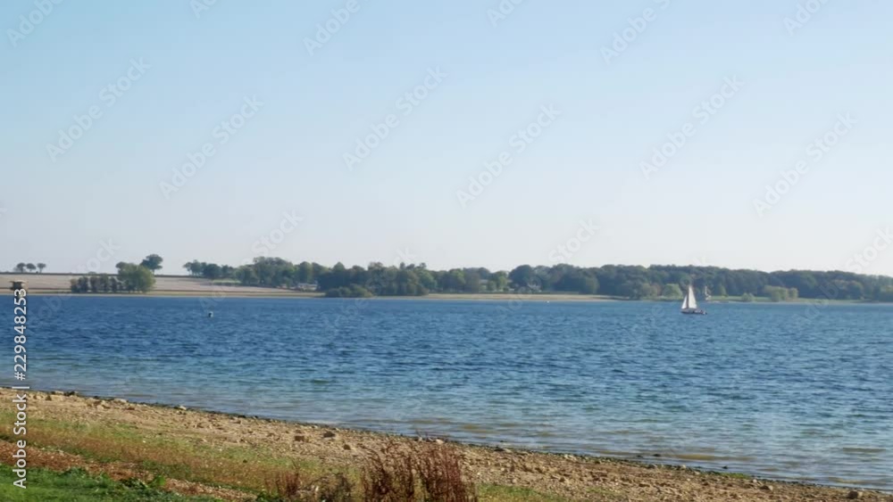 Panning Shot of Boat Sailing on a Lake - 4K Panning Shot of Boat Sailing on a Lake - 4K