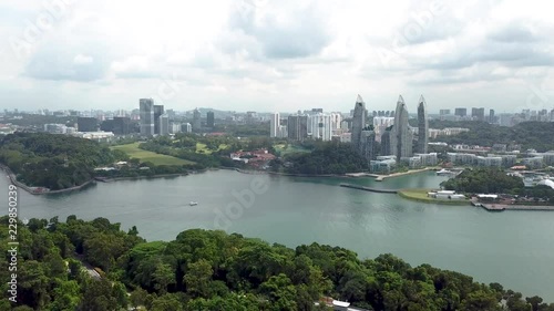 Flying backwards away from the beautiful turquoise river and city of Singapore photo