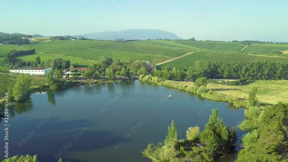 A small reservoir in the middle of crops and farms. 4K A small reservoir in the middle of crops and farms. 4K